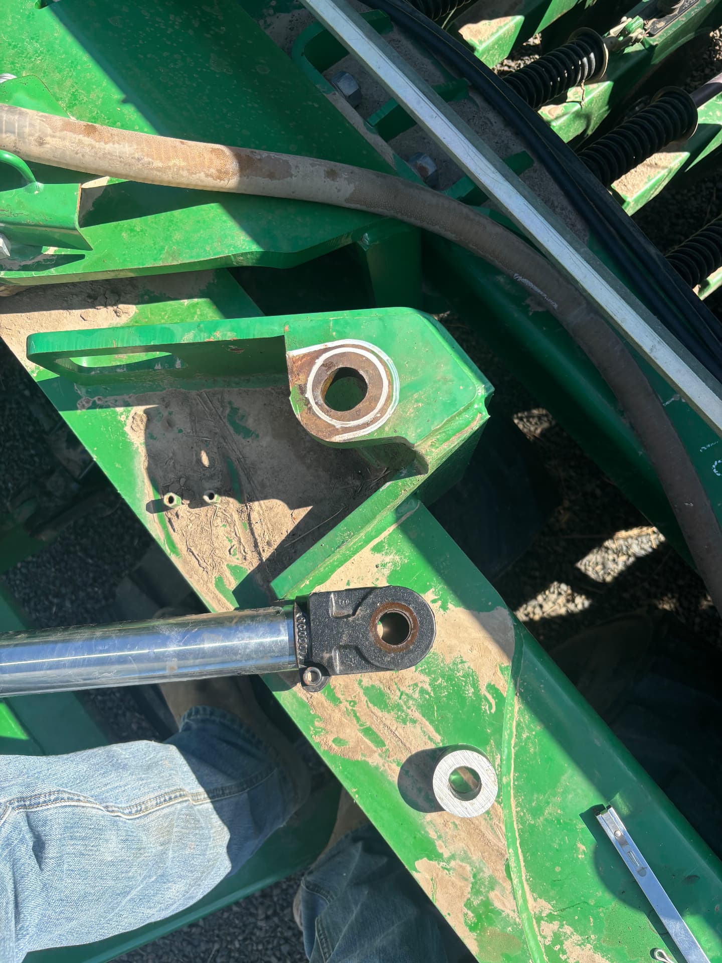 Hydraulic cylinder mounting boss prepared for welded repair on farm equipment