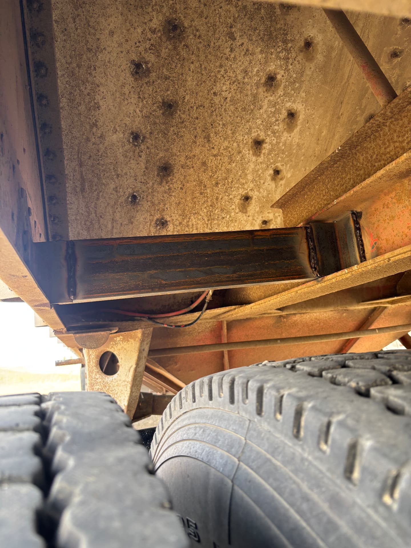 New cross member welded into the underside of a heavy trailer